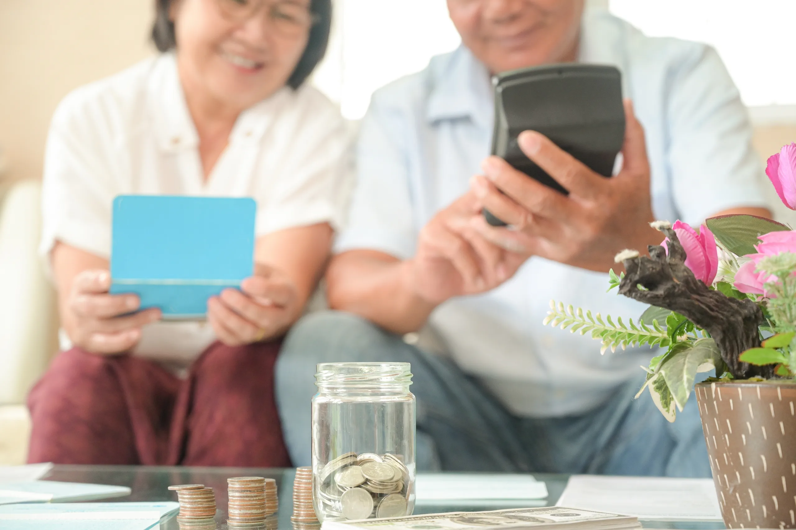 old married couple calculating their finances